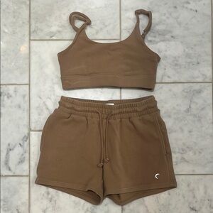 Brown sweat material Bra in a medium (runs small) and Shorts in a small